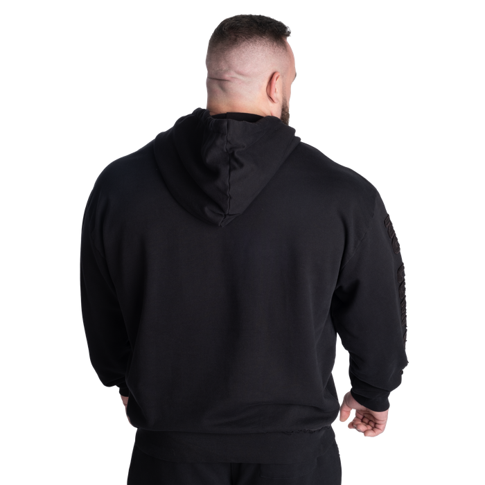 A distressed loose fit hoodie with drop shoulders and v
